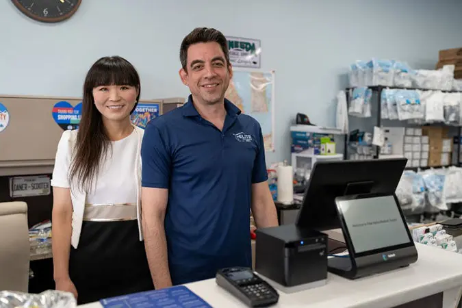 Man and woman behind counter